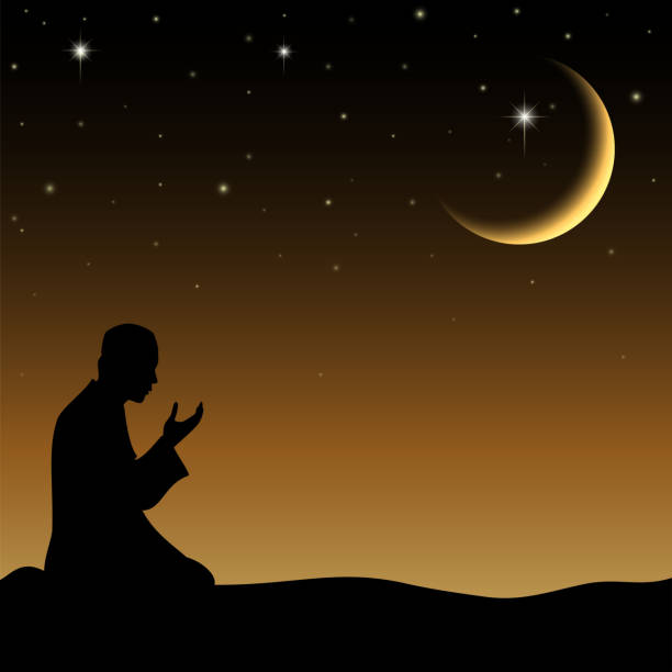 Vector illustration of Silhouette of a Muslim praying in the when night